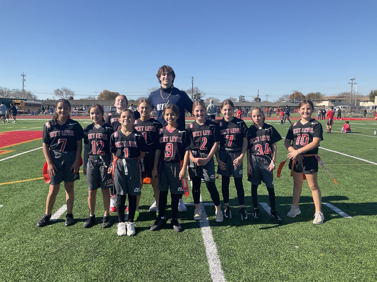 CoachCarnazzo's tweet photo. Palma QB Luke Rossi with his 5th grade Cardinal team. The first ever all-girls NL Palma girls team! They got their first victory yesterday https://t.co/oxJmx6LQxA