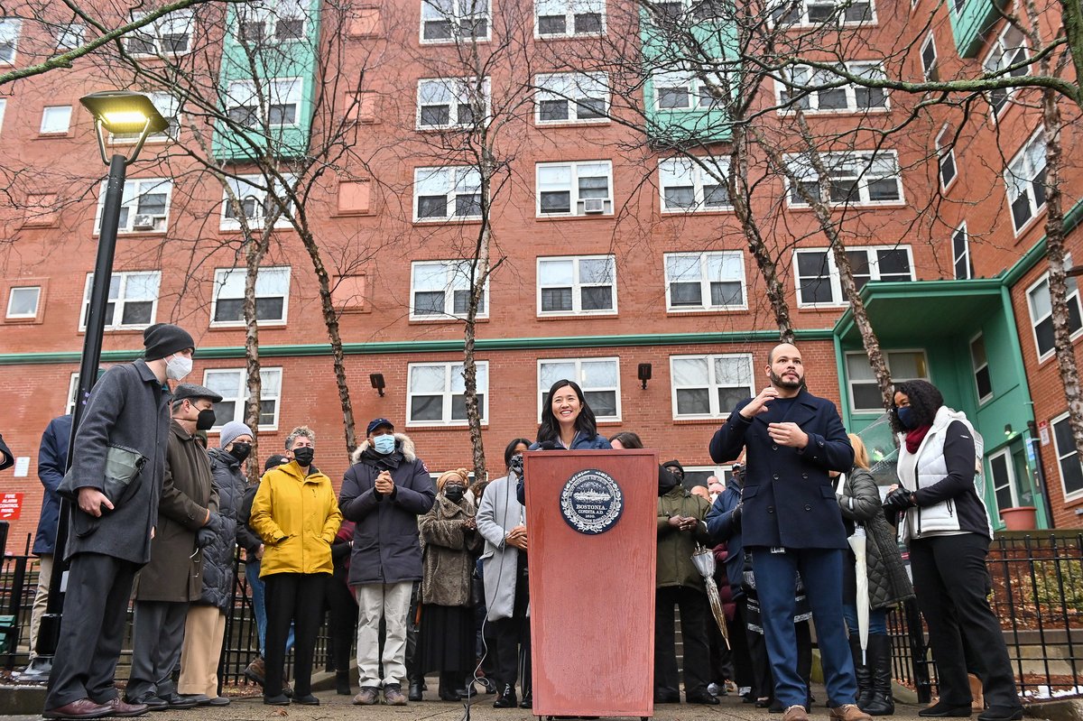 Mayor Wu and other speakers in front of the Mildred Hailey Apartments in Jamaica Plain