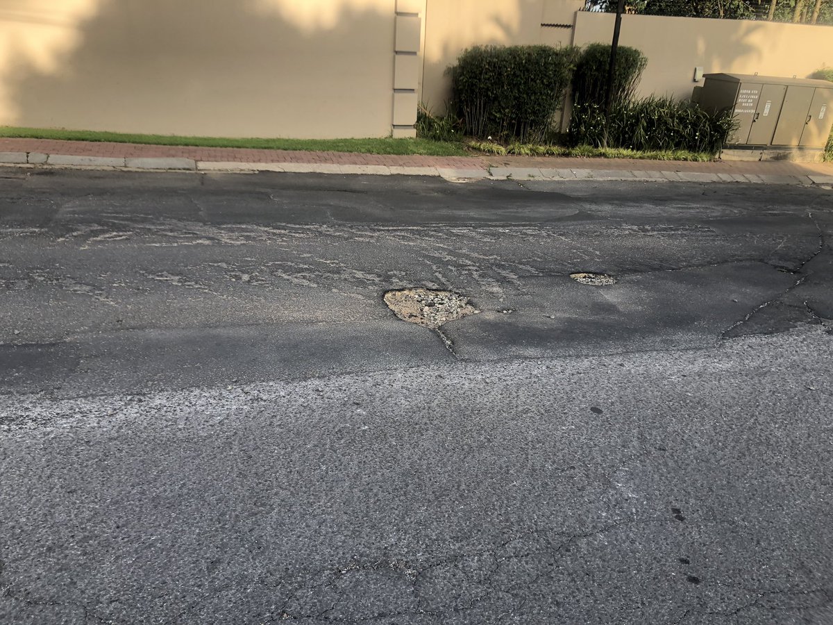 RobynOzinsky's tweet photo. Growing potholes, please can these be fixed asap. 50 west road south morningside sandton @JHBWater @LyndaShacks @CityofJoburgZA https://t.co/fNlY3NWVFX