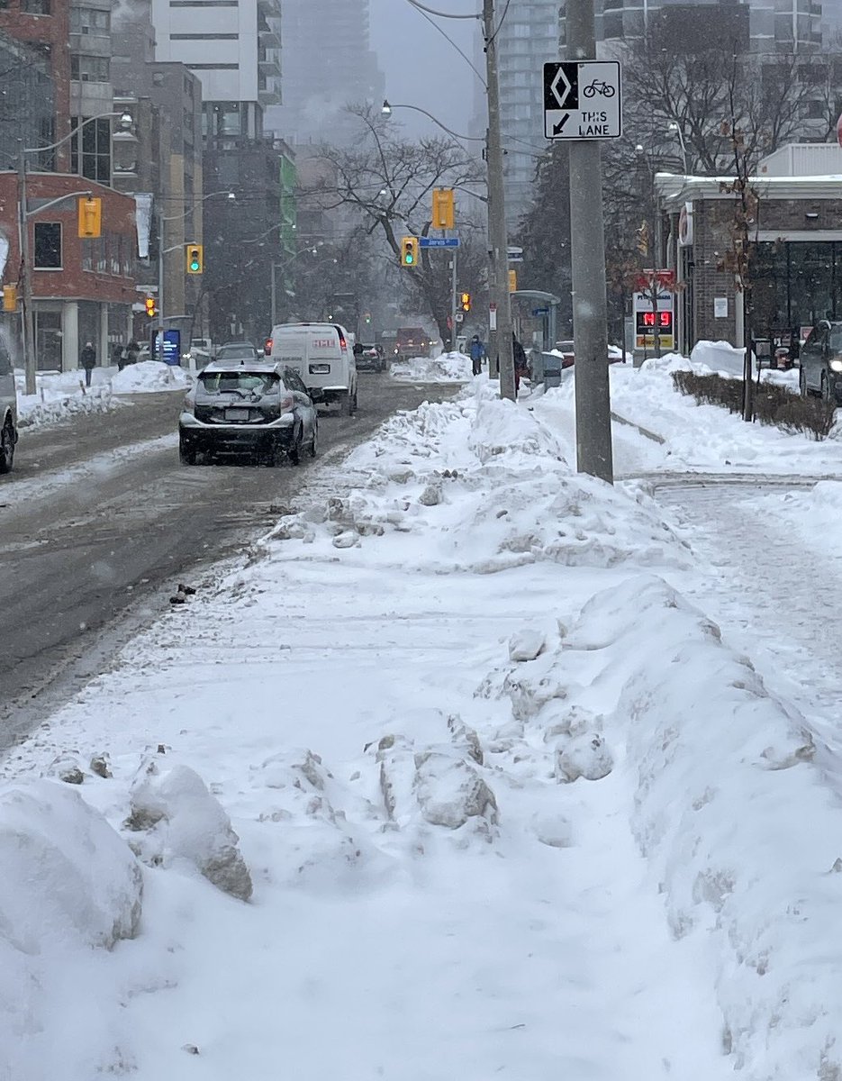 StephanArgent's tweet photo. Anyone know what this is…?  Unrecognizable, it’s actually a #bikelane - the thing the #cityoftoronto @johntory told us would be cleared like the roads in winter.  All it’s done is make driving and cycling more dangerous. #cycling #traffic #toronto https://t.co/9m7g6X8Fp3