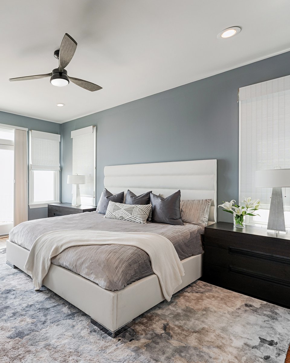 The primary bedroom in this modernized beach home is an absolute DREAM‼️ When designing this space we incorporated neutral design elements, white decor, soft textures &amp; oceanic blues which can be seen throughout the home ✨ How would you design your ideal primary bedroom? 💭