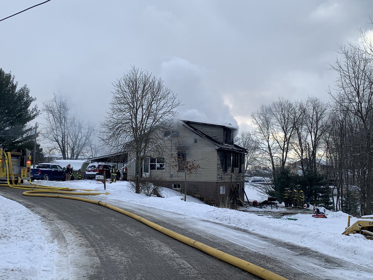 DylanWTOV9's tweet photo. On scene of a house fire on Bakers Road in Hopedale. Smoke is continuing to burrow out of the residence from as crews fight the fire. We’re working to learn more details at this time. @WTOV9 https://t.co/jPxZWnKcPE