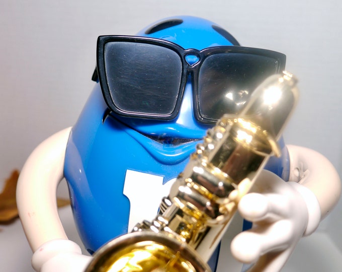 Tuesday Trivia is on at the cafe tonight at 7PM! Come in and join the fun.

Here's little hint to one of the questions. The M&amp;M characters recently underwent a redesign. Back in the 90s, the blue M&amp;M was often seen with signature black shades while playing a saxophone.