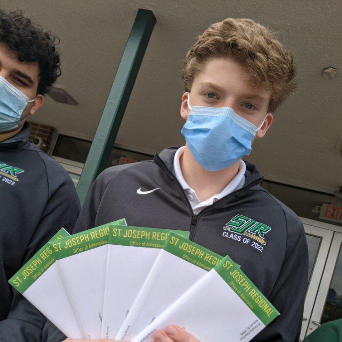 SJRHighSchool's tweet photo. Off they go! Mr. Asselta '94, Ms. Barnett and our Green Knight Ambassadors sending out acceptance letters for the Class of 2026! #SJRClassof26 #VirFidelis #GreenKnights https://t.co/tFk6IOUGXt