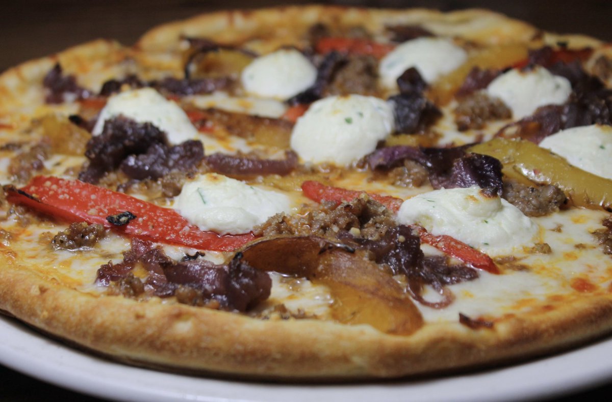 It's a great day for pizza tonight. San Gennaro Pizza - Italian sausage, caramelized red onions,