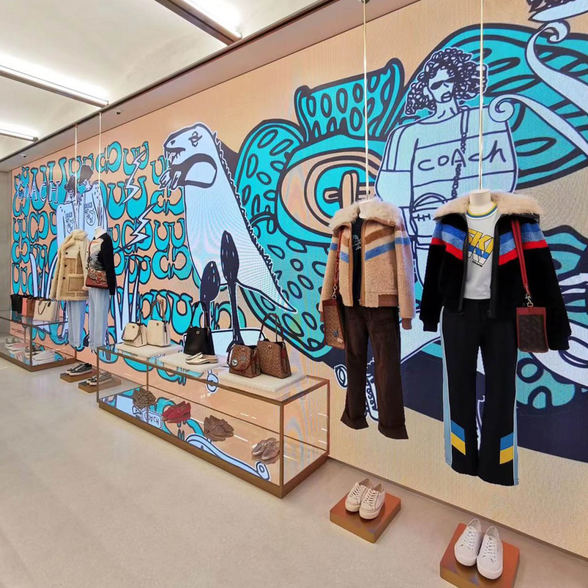 Coach's tweet photo. Shopping with a side of art. 🎨 We collaborated with local illustrator Dandi Gu to create a colorful installation at our store in Shanghai. Swipe right and take a look. (Your admission to this gallery is free.) https://t.co/c3jsdGItbf #CoachNY https://t.co/Xkp6SdpGwl
