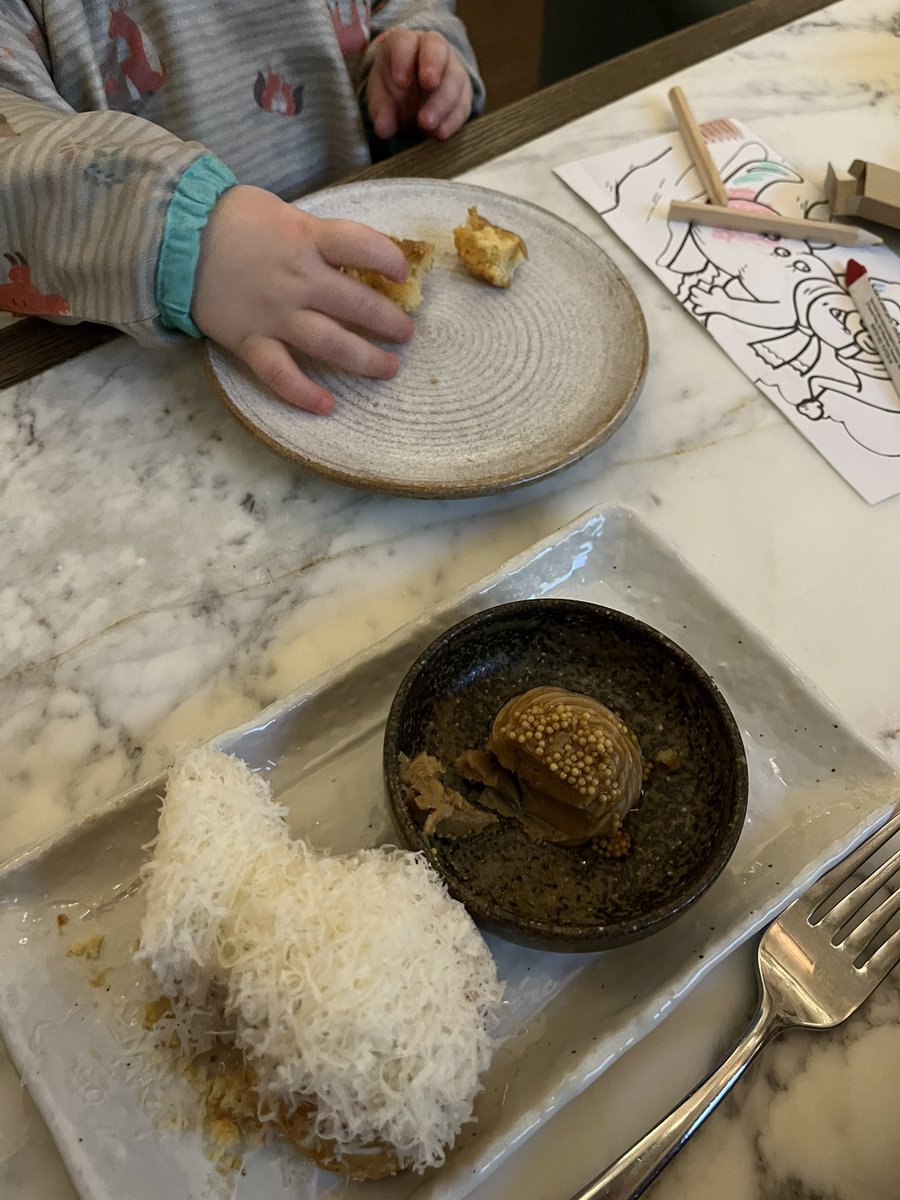 Massive shout out to <a href="/ChefTomKerridge/">Tom Kerridge</a> and <a href="/bullandbearmcr/">The Bull & Bear</a> for looking after my nearly two year old at dinner today. Not every restaurant is accommodating to toddlers! He particularly enjoyed the cheese scones and marmite butter (pictured) and the Tunworth cheese cream!