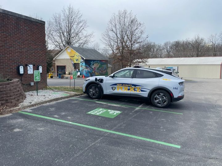 Kudos to the New Albany Police Department on the purchase of their EV now plugged in at our  charging station at Mount St. Francis! Our vehicle charging station is powered by the solar panels installed on our Mission Advancement Office. franciscansusa.org/franciscan-ear…. #ElectricVehicles