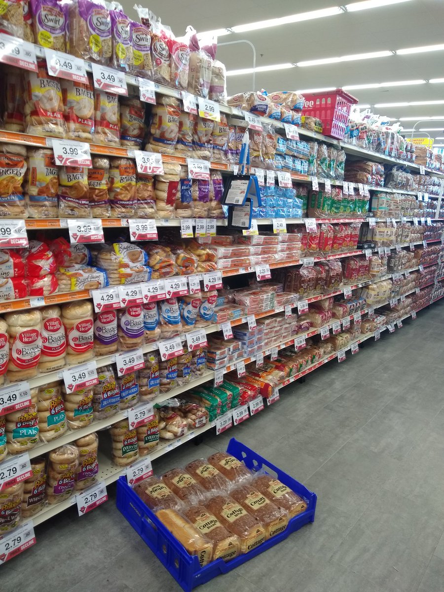 LCMaud's tweet photo. In The North, this is what the bread shelves look like when the forecast has 6-9 inches of snow.

The milk section was also fully stocked.

If it wasn't obvious before, the response to snow makes it abundantly clear I'm no longer living in The South. https://t.co/QtSdbitN2V