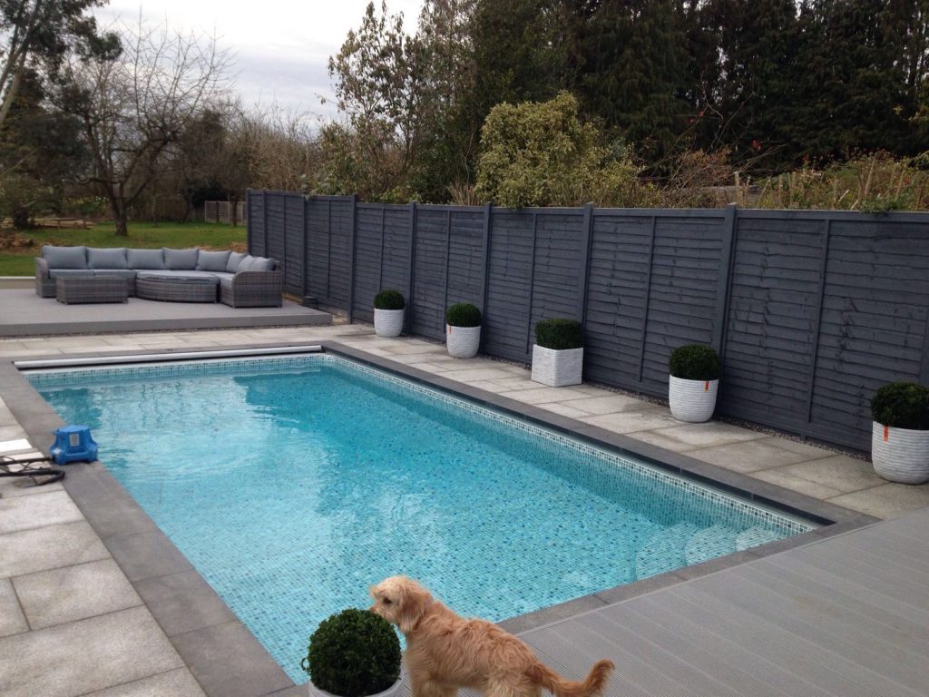 Swimming Pool Decking &amp; Paving 💦

Composite decking and 140m² of clean, silver-grey granite slabs for paving. 👌
#landscaping #landscapedesign #pool #Garden #decking #Cambridge