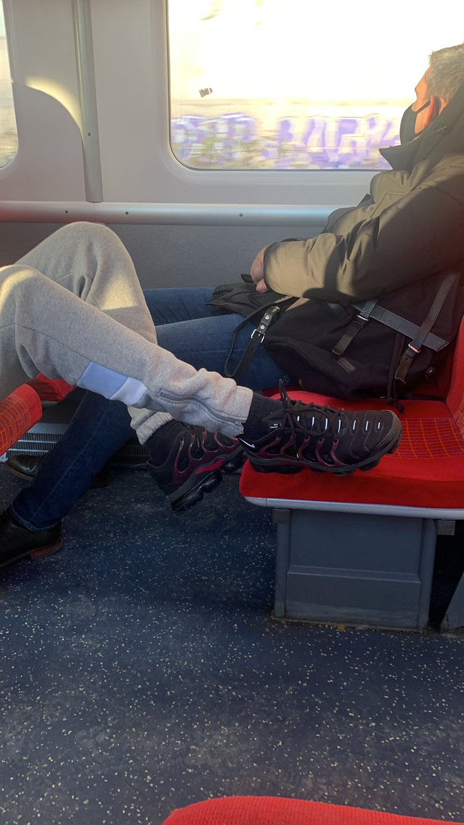 Todays idiot with feet on the seat, no mask either
