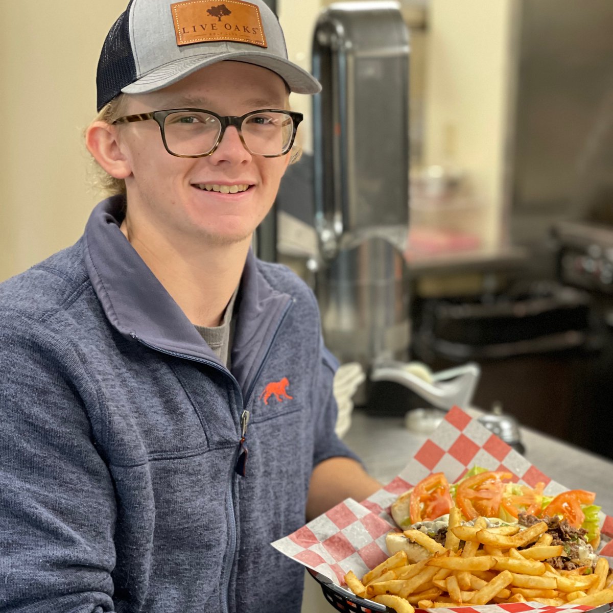liveoaksgolf's tweet photo. This guy!! Is our guy!! #ConnorP delivering one of our #PhillyCheeseSteak sandwiches! Join us here at #ROOSEVELTS and he can get you one too! We’re open until 3pm today. Call 601-982-1231 for takeout orders. https://t.co/cpr8wVNxZg