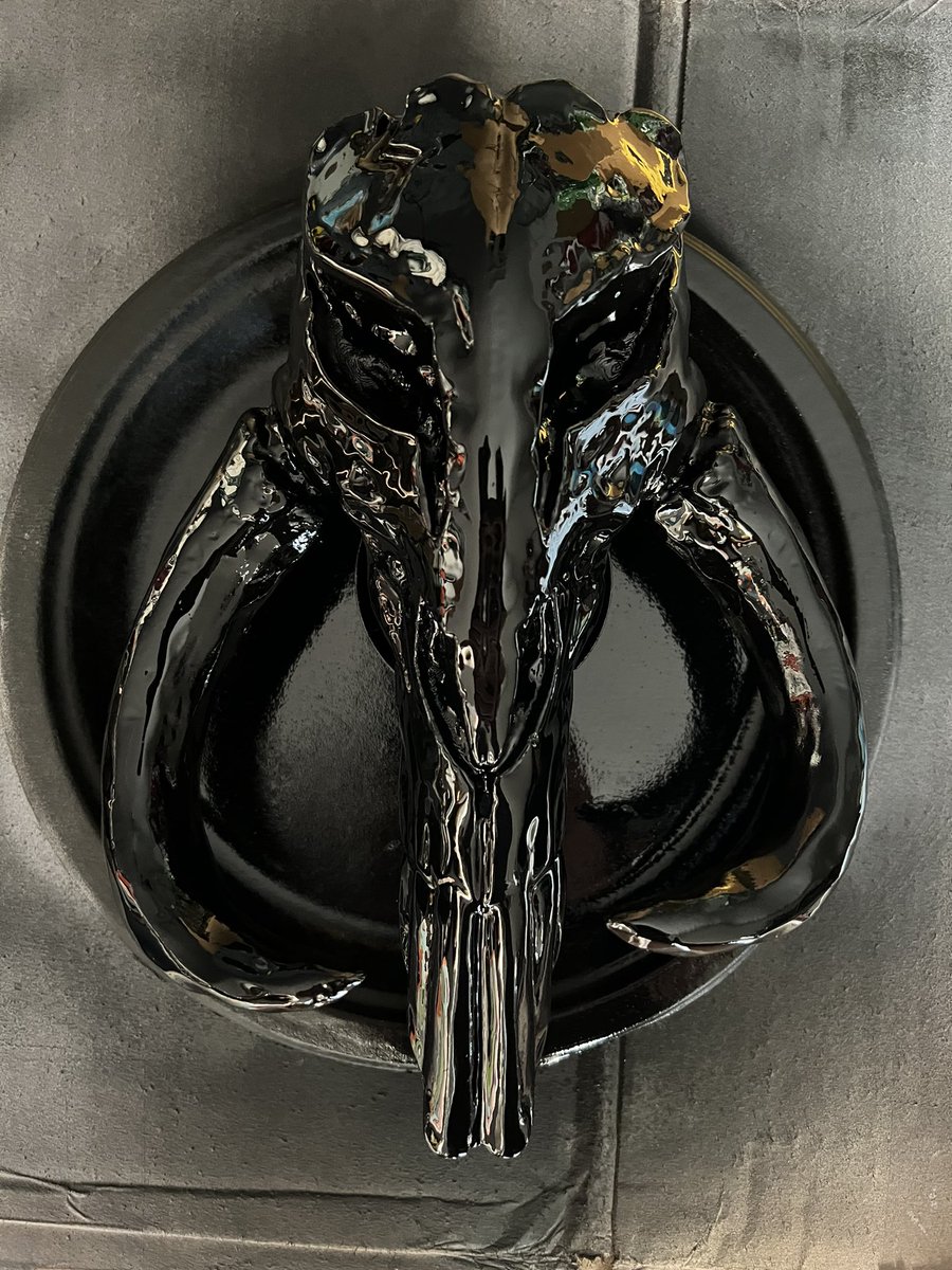 Finishing up another mythosaur skull. Just put on the last coat of black base and tomorrow I start on the silver.