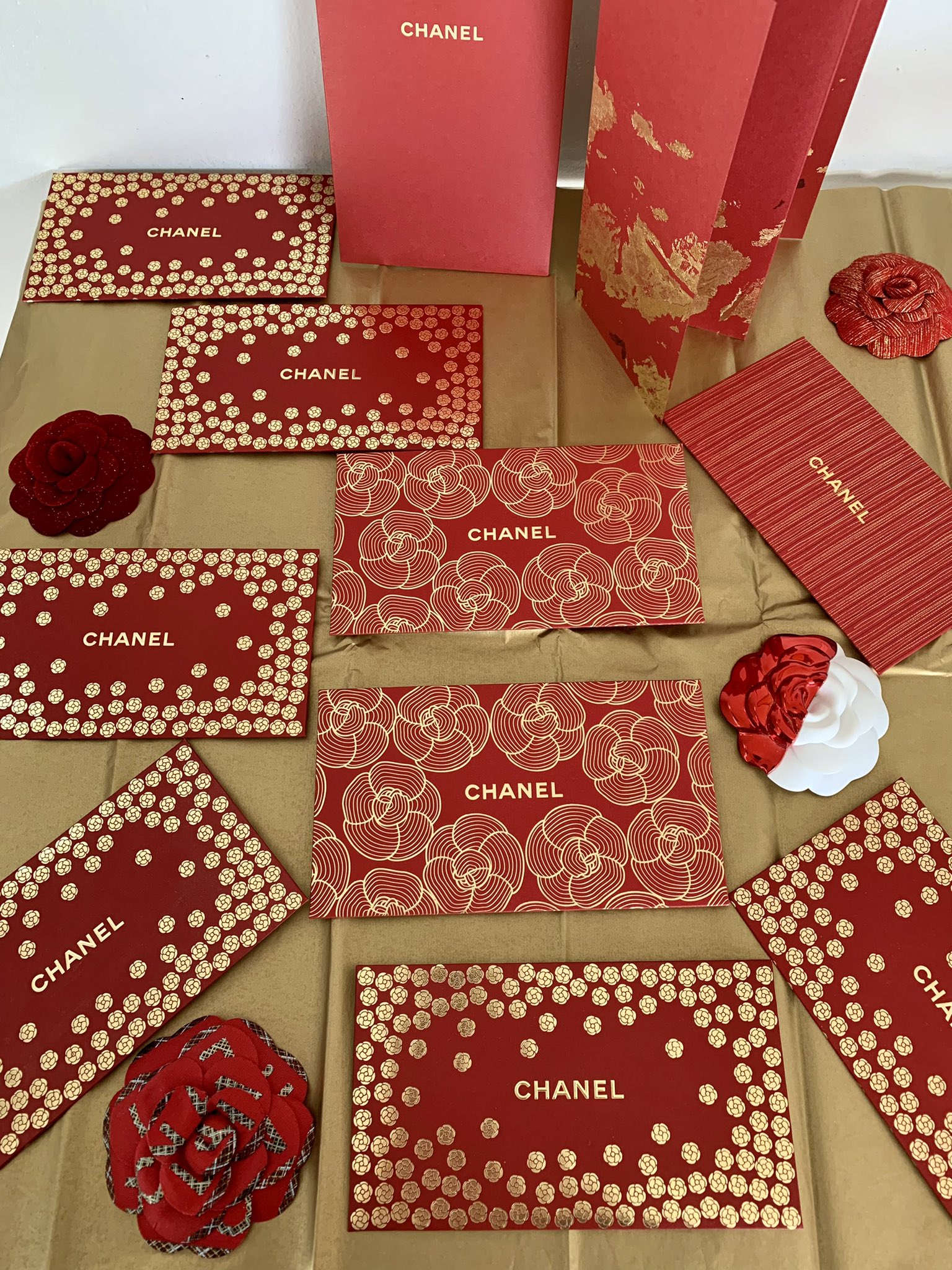 Cookie Gigan on X: So these are all my Chanel Red Envelopes and some red  camellias from over the years. This year for the Lunar New Year it is the  year of