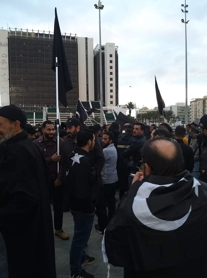 LOVELYCYRENAICA's tweet photo. #Bargha " CYRENAICA " flags fluttering in the courtyard of the Tibesti Hotel in Benghazi today https://t.co/KR8hmaqspA https://t.co/PNElEQHMd3