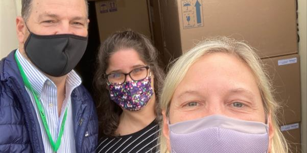 WADeptHealth's tweet photo. Love knowing there’s big smiles under these masks! These school district employees were thrilled to receive a shipment of new COVID-19 tests today! #COVID19 #COVID #supportpublichealth https://t.co/om9pLuvOff