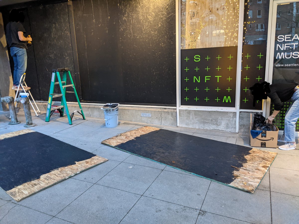 Nothing says 'ready for opening night' like boarding up all of your windows an hour before your event #seattlenftmuseum #seattleprotest #fucknfts