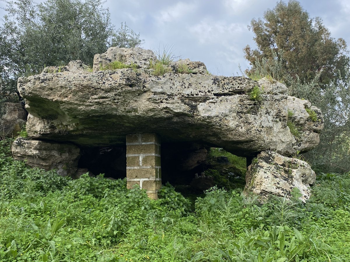 The dolmen of Avola sits on the edge of a small valley called the Cava L’Unica. It's almost eight metres in length and five and a half metres in width. It's considered to be pseudo-dolmen because it might be a natural formation.