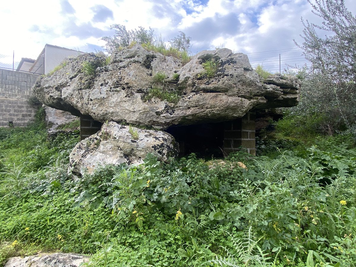 The dolmen of Avola sits on the edge of a small valley called the Cava L’Unica. It's almost eight metres in length and five and a half metres in width. It's considered to be pseudo-dolmen because it might be a natural formation.