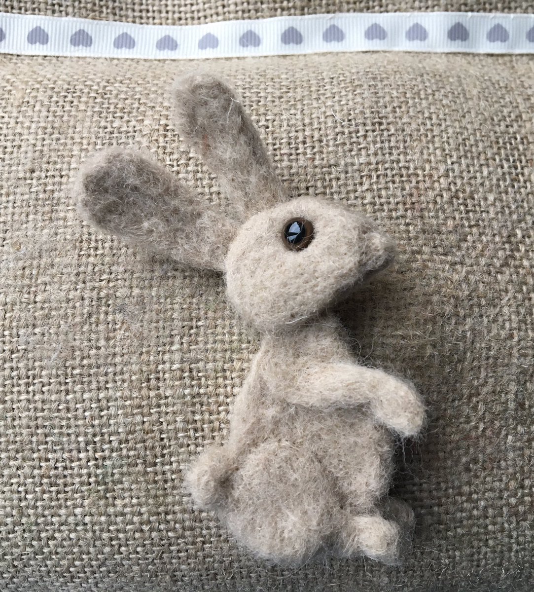 This little bunny is getting ready to hop off my needle felting mat and into my Etsy shop.