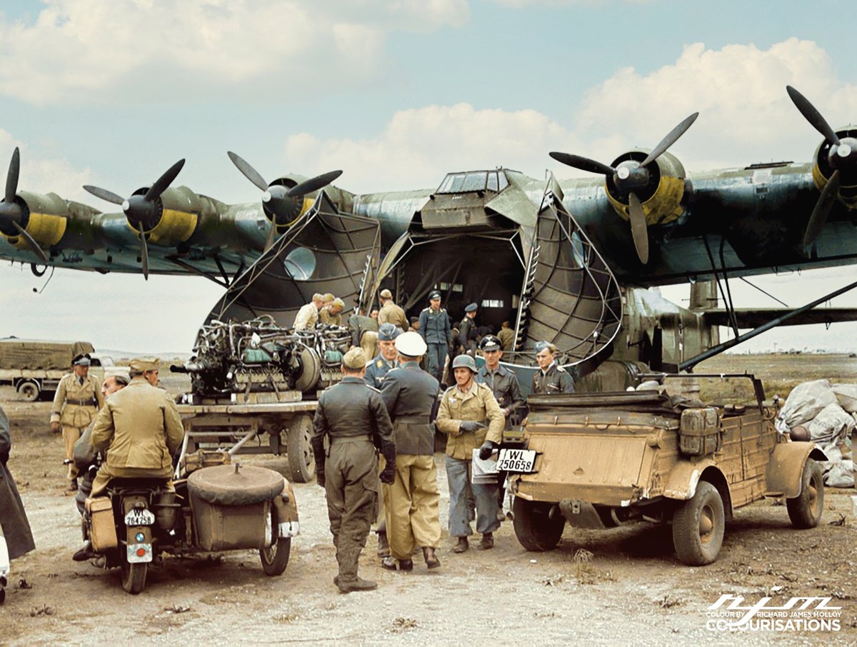 The Cavernous interior of the Messerschmitt 323 is clearly illustrated in this photograph showing a pair of DB 605 aircraft engines and other cargo being disgorged.
read about the Wehrmacht's efforts to expand it's available airlift capacity in the latest issue of <a href="/IronCrossMag/">Iron Cross Magazine</a>