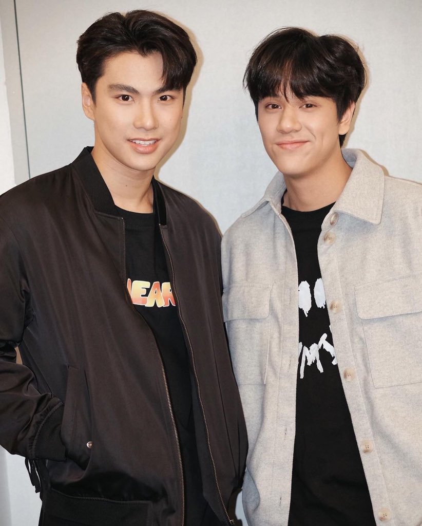 ohmiilette's tweet photo. nanon's expression seems saying “you want this guy beside me? well sorry to tell but you cannot have him” https://t.co/wVb2xr7EUo