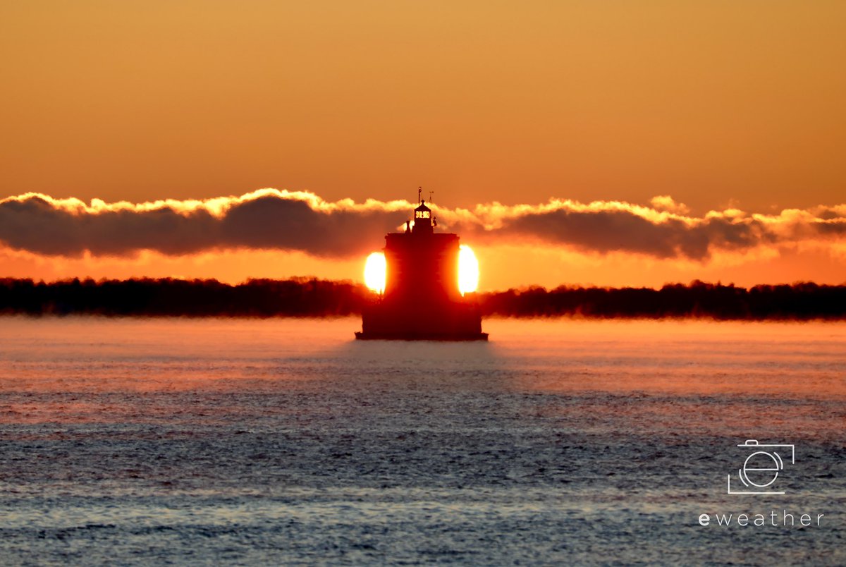 A gorgeous, cold #sunrise this morning behind New London CT #LedgeLight with #seasmoke! #stormhour