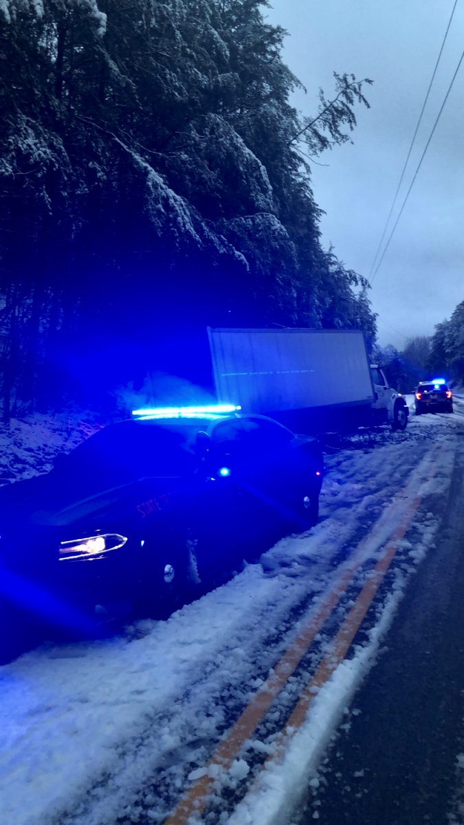 Please avoid non-essential travel in areas impacted by the storm. CPL Cody White, Post 37-Cumming, assisting a motorist that lost control due to icey roadway conditions in Lumpkin County this morning. #BuckleUp #SlowDown #gatrooper #gsp #WinterWeather #Izzy