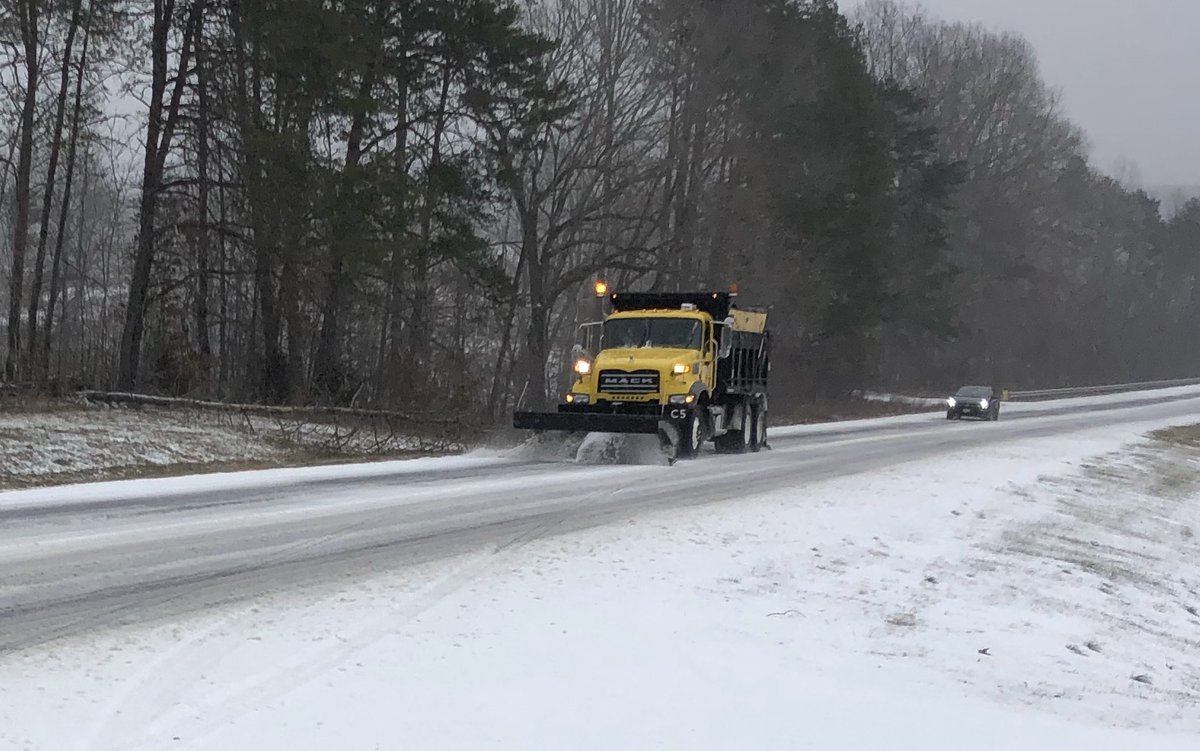 NCDOT's tweet photo. Since last night, crews have been working non-stop to clear roads across NC. 
By 3p, more than 1,800 employees in almost 1,200 trucks had applied nearly 10,000 tons of salt while plowing essential routes. 
🙏 We see you. 
#ncwx https://t.co/vEbNahIGdz