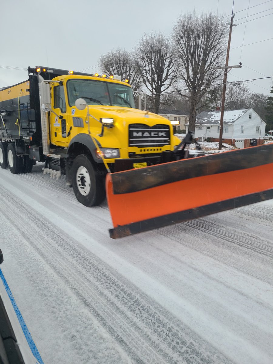 NCDOT's tweet photo. Since last night, crews have been working non-stop to clear roads across NC. 
By 3p, more than 1,800 employees in almost 1,200 trucks had applied nearly 10,000 tons of salt while plowing essential routes. 
🙏 We see you. 
#ncwx https://t.co/vEbNahIGdz