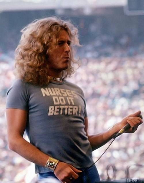 crockpics's tweet photo. Robert Plant wears a "Nurses do it Better shirt" during a Led Zeppelin concert to honor his then wife Maureen, who was a certified nurse. 1977 https://t.co/eCusbnkDtA