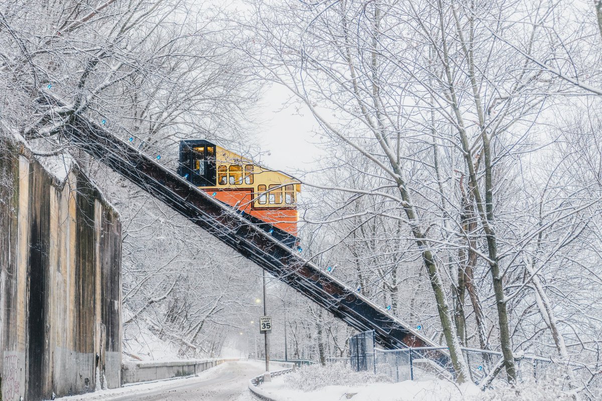 So many new snowy images of #Pittsburgh to share, but we'll start with one of my favorites from today. The Mon Incline happened to be crossing above PJ McArdle Roadway just as I was driving by this morning, and framed by the snow covered trees, created a perfect scene.