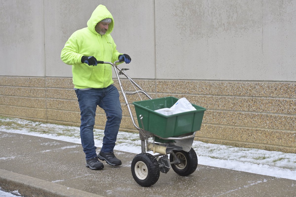 Jim Bryson of High Associates spreads an ice deterrent on a sidewalk along the 1700 block of Hempstead Road in East Lampeter Township. ⁦<a href="/LancasterOnline/">LNP | LancasterOnline</a>⁩