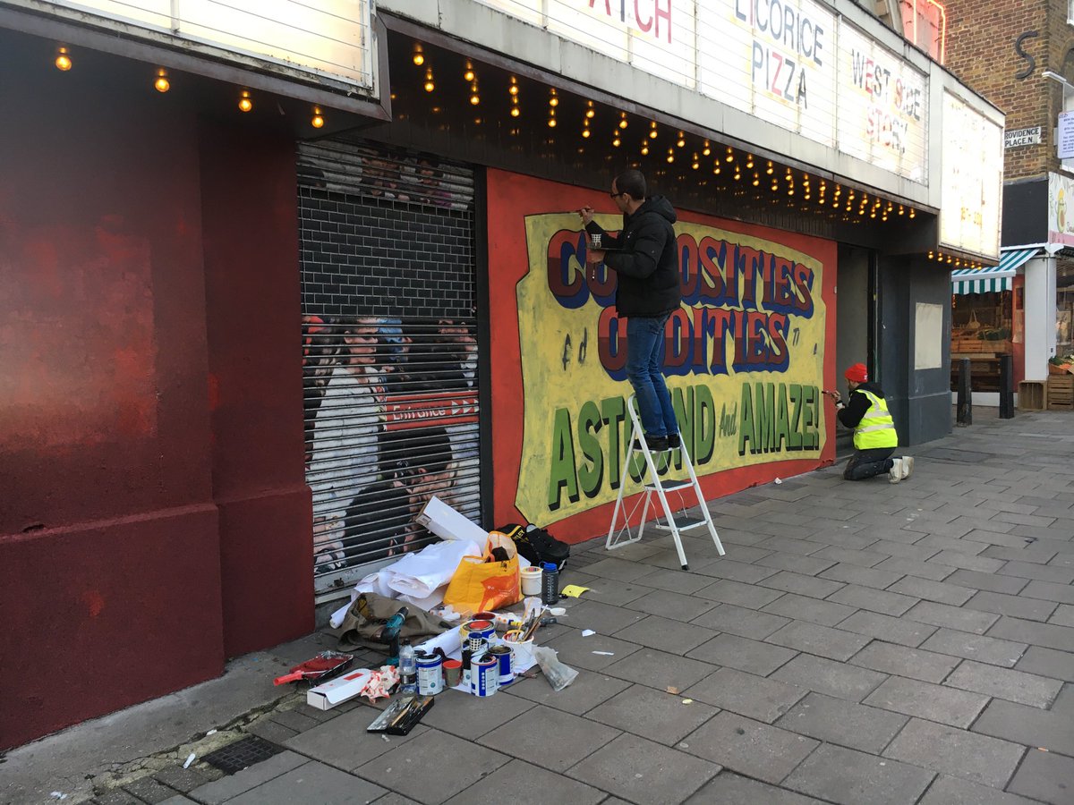 janeslondon's tweet photo. Curiosities and Oddities Astound and Amaze. 
Two sign writers busy outside ⁦@ScreenOTGreen⁩ ⁦@islingtongztte⁩ today on promo for #nightmarealley #signwriters #handpainted https://t.co/pSHvT4aQVp