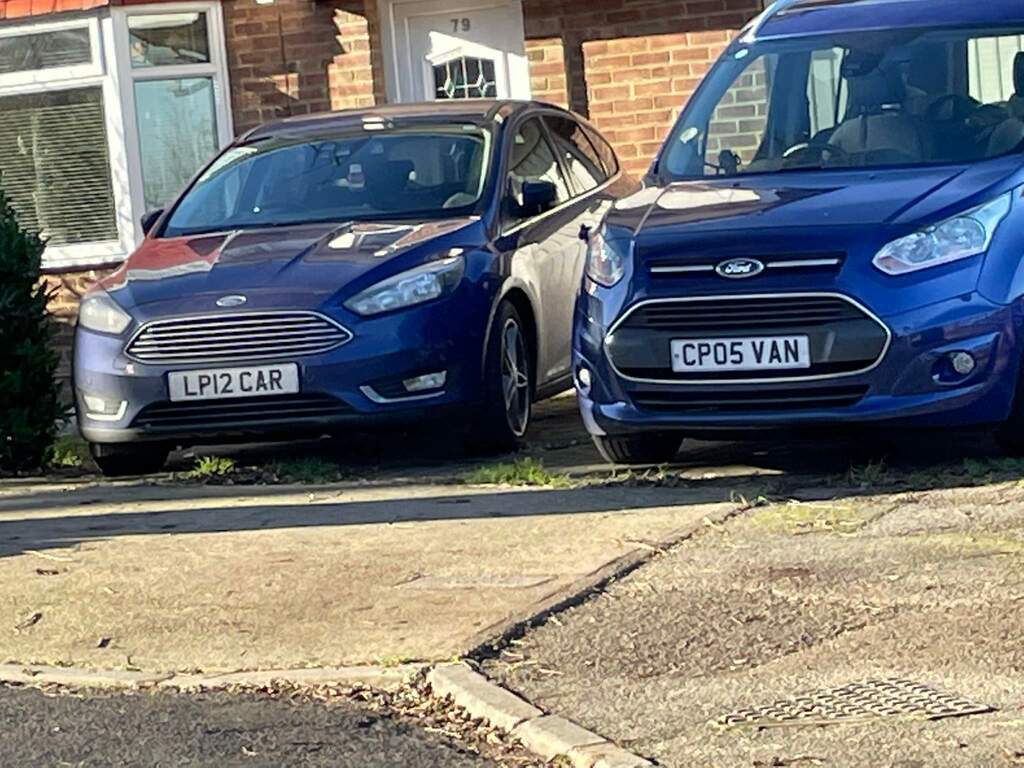The car has a "car" licence plate, the van has a "van" licence plate