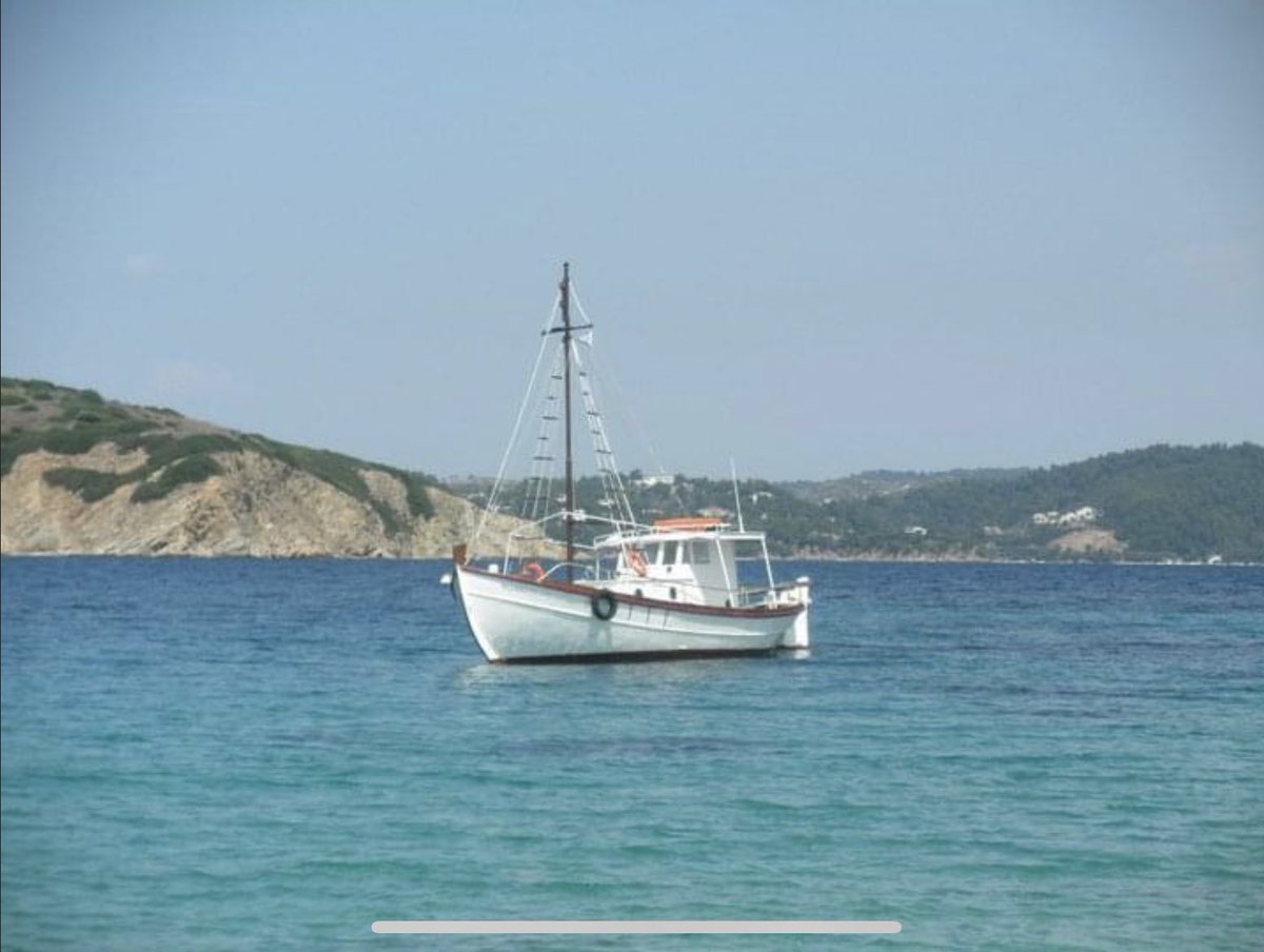 Sometimes on a brisk morning, it’s nice to have a warm place to think about!  Here’s a fishing boat I took a photo of from Skiathos, Greece!
