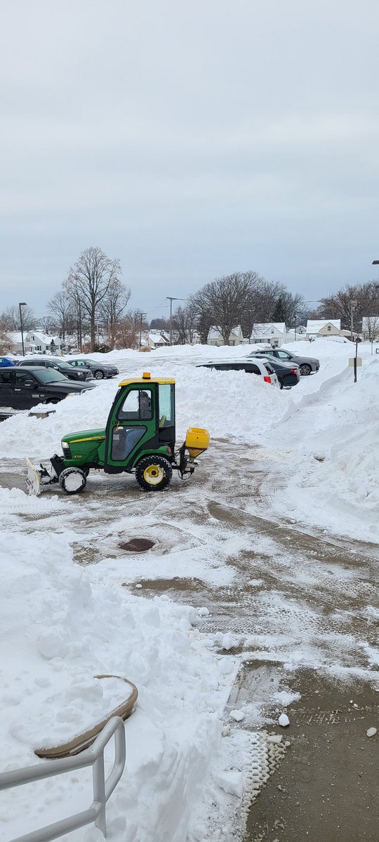 Our awesome maintenance staff working to get all this snow cleared!