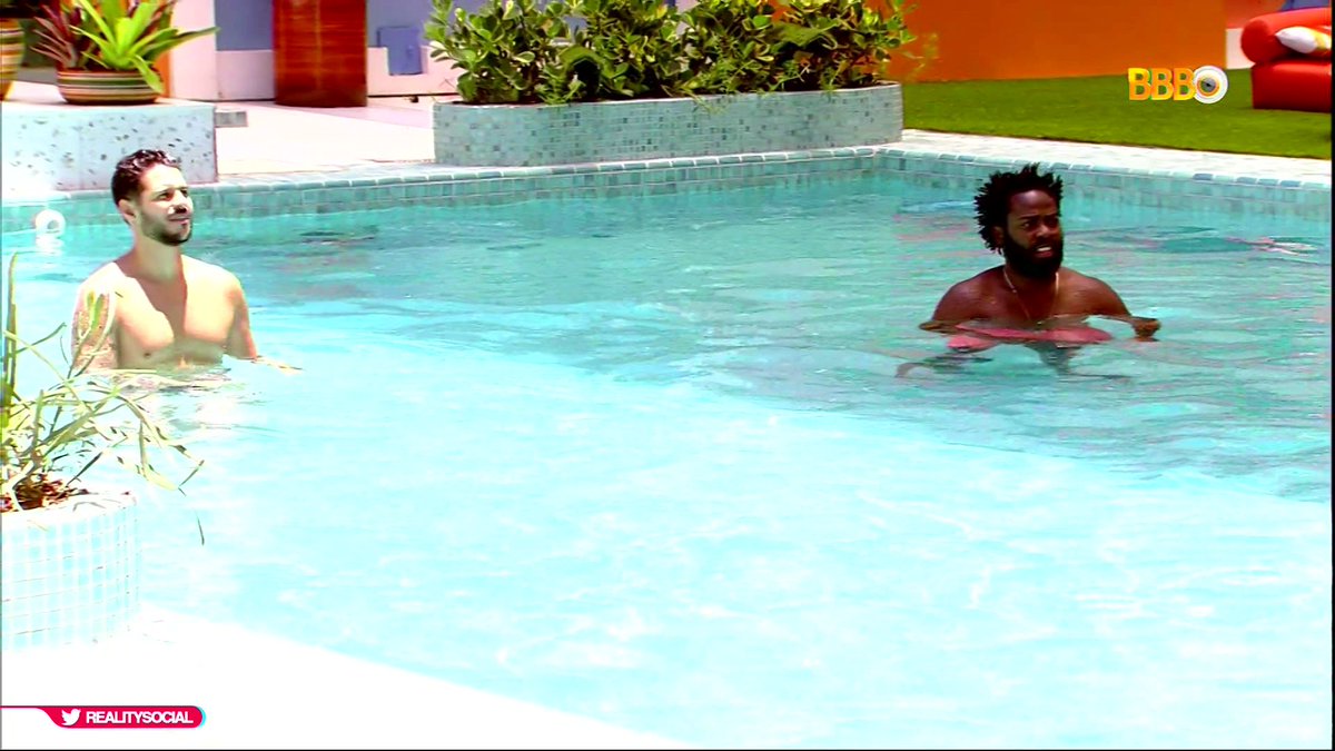 two bros chillin in a hot tub.