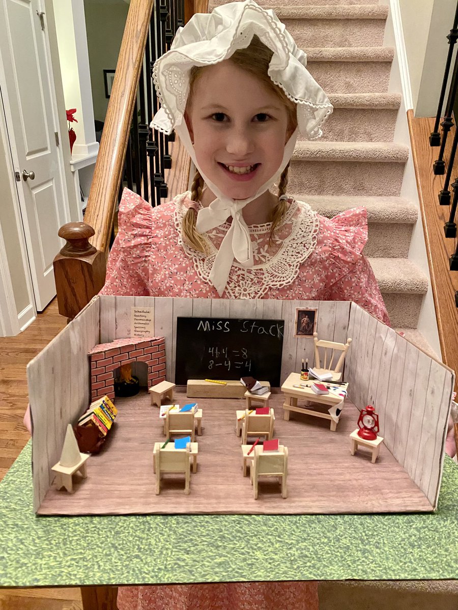 MrsMStack's tweet photo. It’s colonial project/presentation time. This colonial schoolmaster is ready to teach her class all about going to school in the 1700s and had some fun inserting herself in her diorama with the green screen today! #aNAISing https://t.co/B64whUhT7e