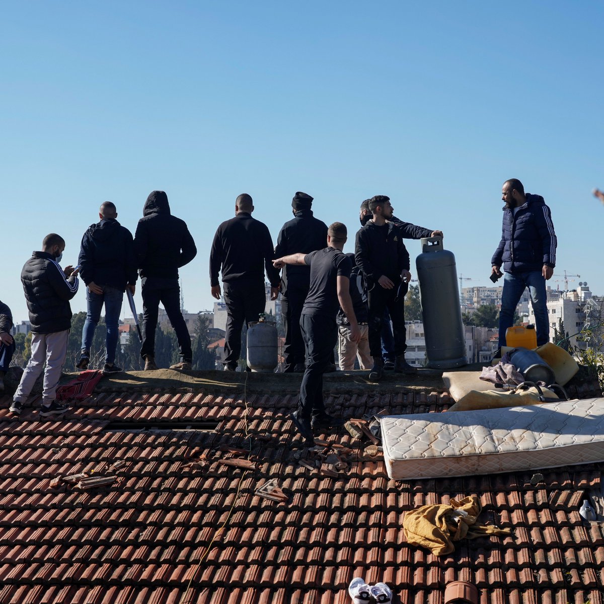 ajplus's tweet photo. Israeli police backed off from forcing a Palestinian family from their home, after they protested on the roof and crowds defended them. It is unclear if police will return.

Israel wants to displace 1,000+ Palestinians in occupied East Jerusalem to make way for illegal settlers. https://t.co/pzKgZPjMqT