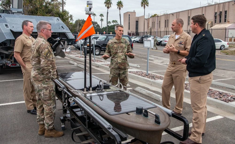 Members of Naval Special Warfare (NSW) show a #WaveGlider, an #autonomous, unmanned surface #vehicle to Gen. Richard D. Clarke, U.S. Special Operations Command (#USSOCOM) commander, and Chief Master Sgt. Gregory A. Smith, USSOCOM senior enlisted #leader.