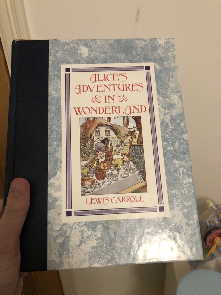 MikeWeirMusic's tweet photo. Excellent item of post from @weir_dj - this book had been resting on the shelf since I had it as a child. I was so excited to receive this as a gift in the early 1990s. Now young Weir #1 is reading it, he may be in an Alice show this year. I breathed in the old book smell today! https://t.co/RHJTTYxOl4