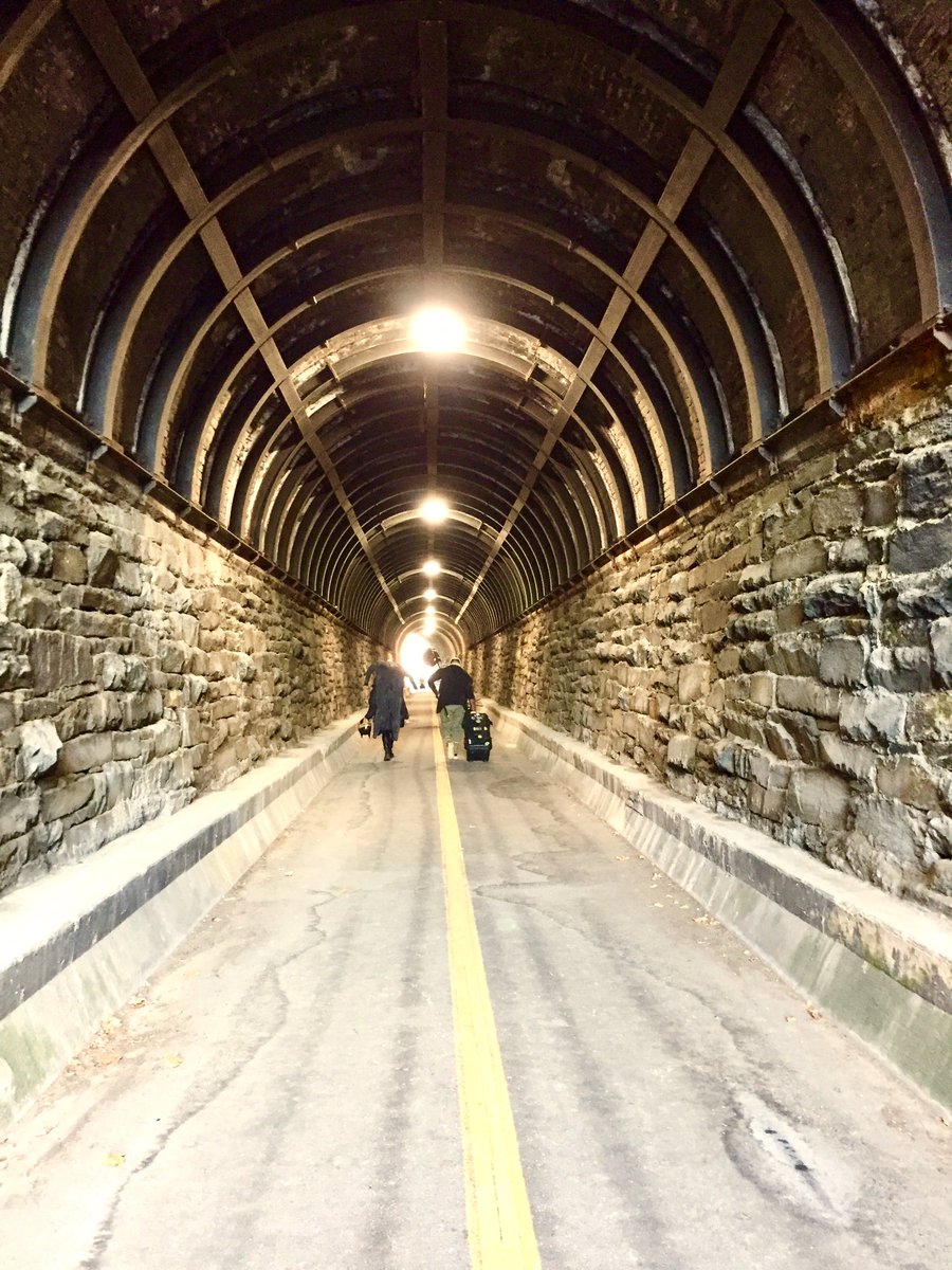 HobanGirl's tweet photo. In the fine company of cameramen who had just wrapped for the day. The trio’s as taken with the old RR tunnel as I am. #WilsonBridge is gilded as the sun lowers. So are the mews off #UnionStreet. Views from the heights never disappoint. #Potomac #OldTown #Alexandria https://t.co/HXx3jI7th9