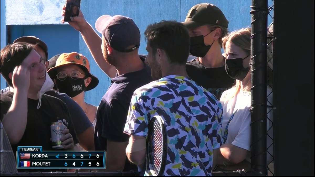 MEANWHILE, Moutet saves two match points, holds for 6-all in the fifth, and stops to take a selfie with a fan.