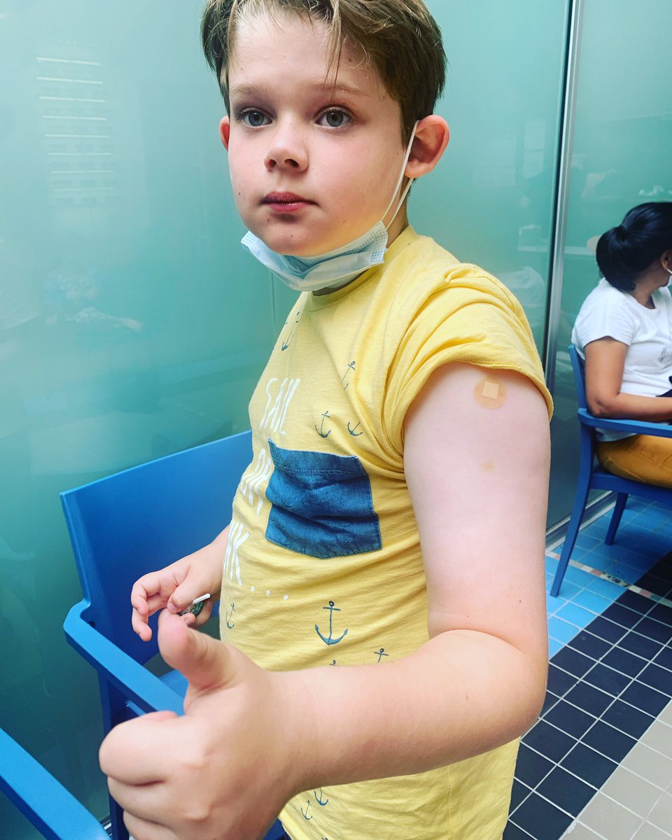 This 10 year old dude got his first vaccine today! He’s eating a lolly hence no mask. He took it like a champ and <a href="/HuwHigginson/">Huw Higginson</a> and I are so proud #VaccinesWork #Pfizer