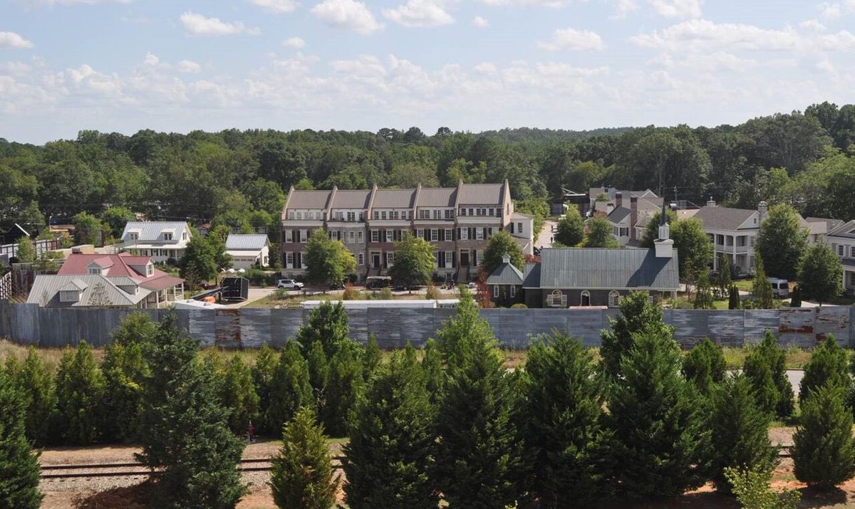 TWalkingDWorld's tweet photo. The set walls &amp; gates of Alexandria in Senoia, Georgia will be taken down by June 2022 after filming has wrapped in March.

Additionally, the windmill &amp; other sets will be removed and landscaping will be redone. The homes built for the show will be restored and sold.

#TWD https://t.co/apqzZMkC51