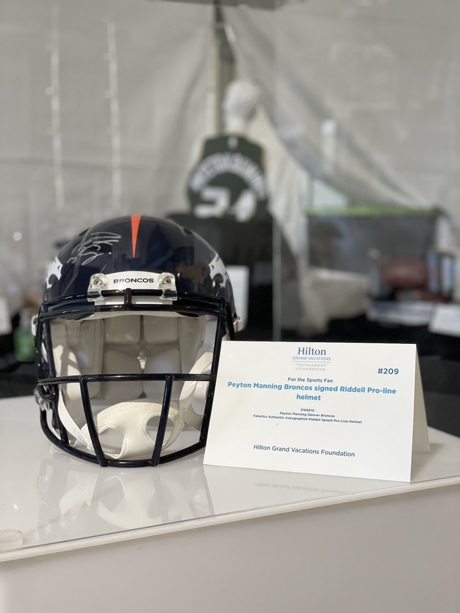 HiltonGrandVac's tweet photo. Bidding is live! Get your hands on exclusive sports memorabilia like this #PeytonManning #Broncos signed Riddle Pro-line helmet! Make a bid. Make a difference. https://t.co/FMXe09QQd5 #MoreThanGolf #HGVLPGA https://t.co/nwJvkjFqJp