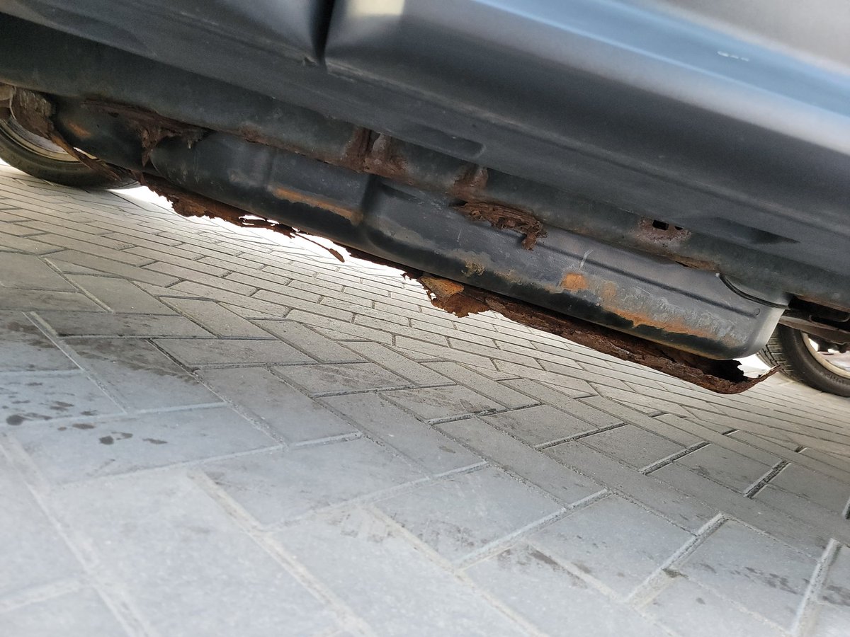 jaromp's tweet photo. Really, @Carvana? This passed your "rigorous inspection process" and I was afraid to drive it away from my vehicle pick-up... That's the gas tank falling out, if you were wondering. https://t.co/vBh2Lyg7KA