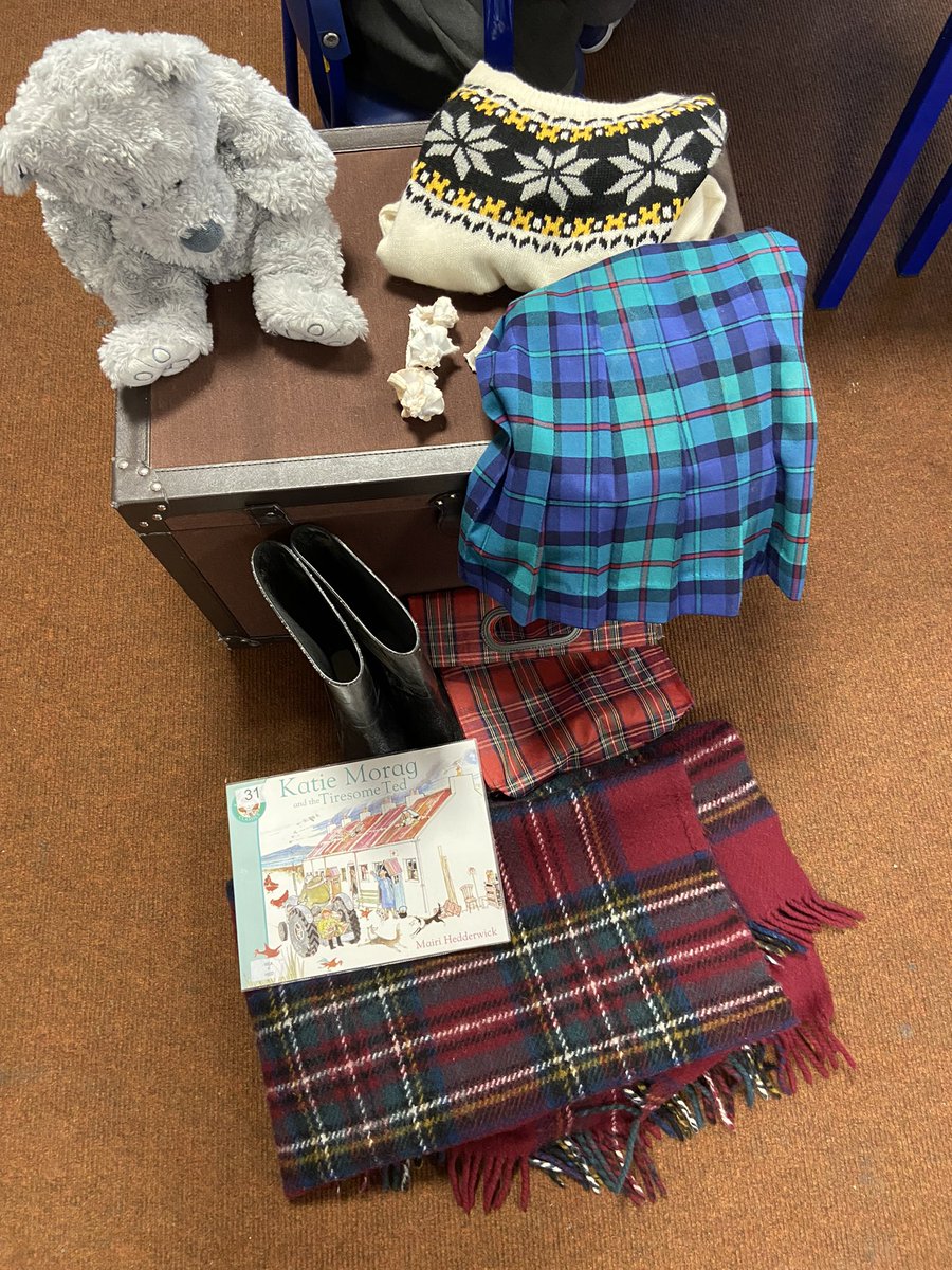 P1Laurieston's tweet photo. 1/3 Setting the scene for today’s writing task. Who owns a jumper, kilt, wellies and teddy that look like this? 
Katie Morag of course! An excellent pre writing discussion! #developingearlyliteracy https://t.co/ptcu0KohvT