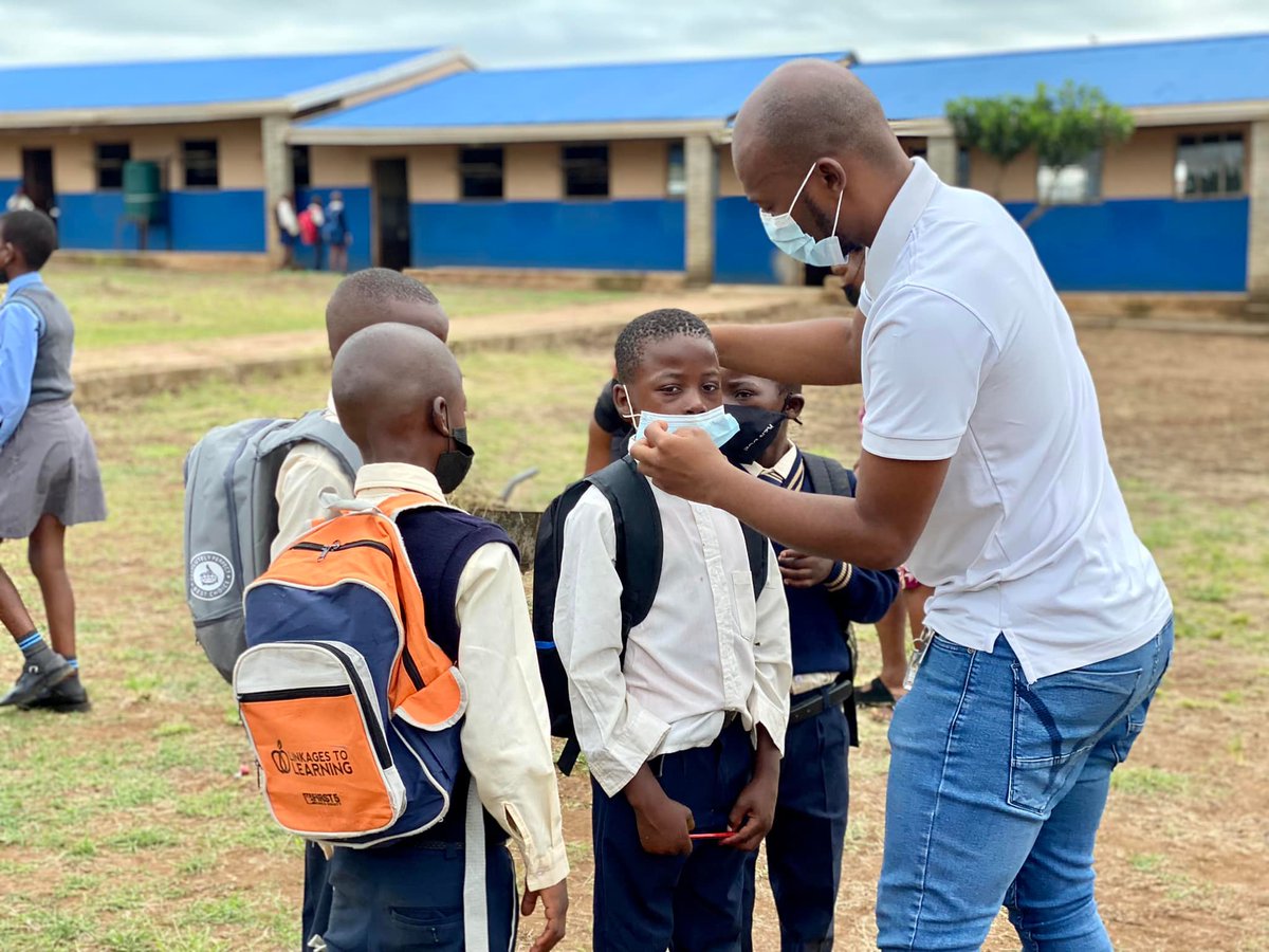 StarForLife_SA's tweet photo. For many learners, today marks the first day back to school in the new academic year. Star for Life coach, Skhumbuzo Mnguni, is seen welcoming back learners at Hluhluwe Public Primary School. 
#starforlife #Back2School #empoweringyouth https://t.co/Ax6GrXHwaj